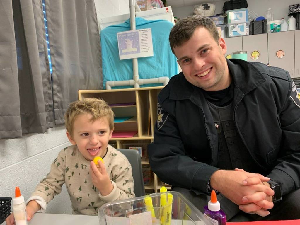Officer with Pre-K student
