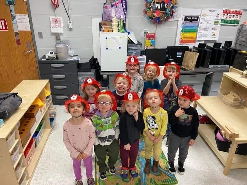 Rupert Pre-K with fire hats on