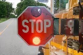 School bus with stop-arm extended